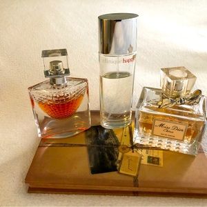 Bundle of three perfumes partially used.